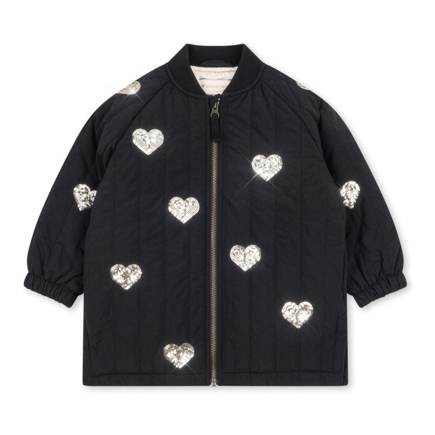 Konges Sløjd Winterjas Juno Sequin Long Jacket Black, lange zwarte winterjas met pailletten op witte achtergrond