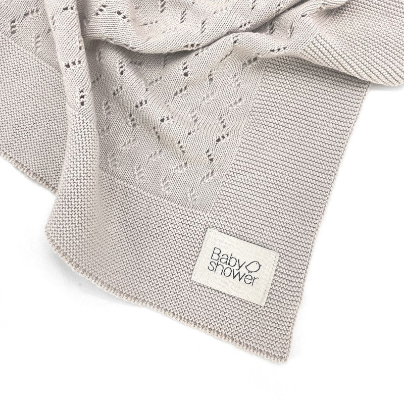 Babyshower Wiegdeken Tricot Classic Beige, close-up van de afwerking aan de rand